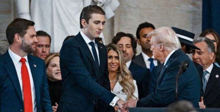 barron trump's thanksgiving appearance with his father goes viral online.
